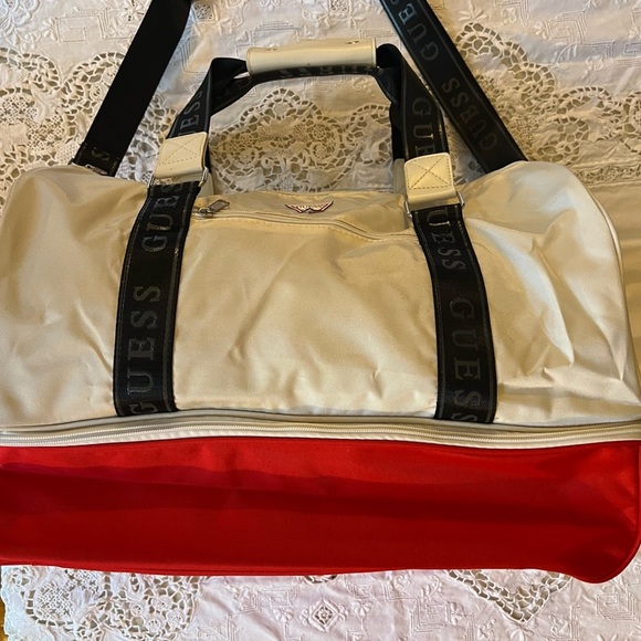 Guess white/cream colored, tote with extra red storage on the bottom. - Picture 5 of 7